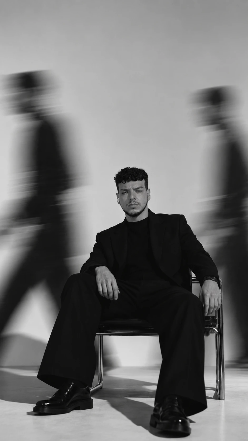 Ruben Muñoz Di Clemente, Branding at Soratti, seated in a black and white studio portrait.